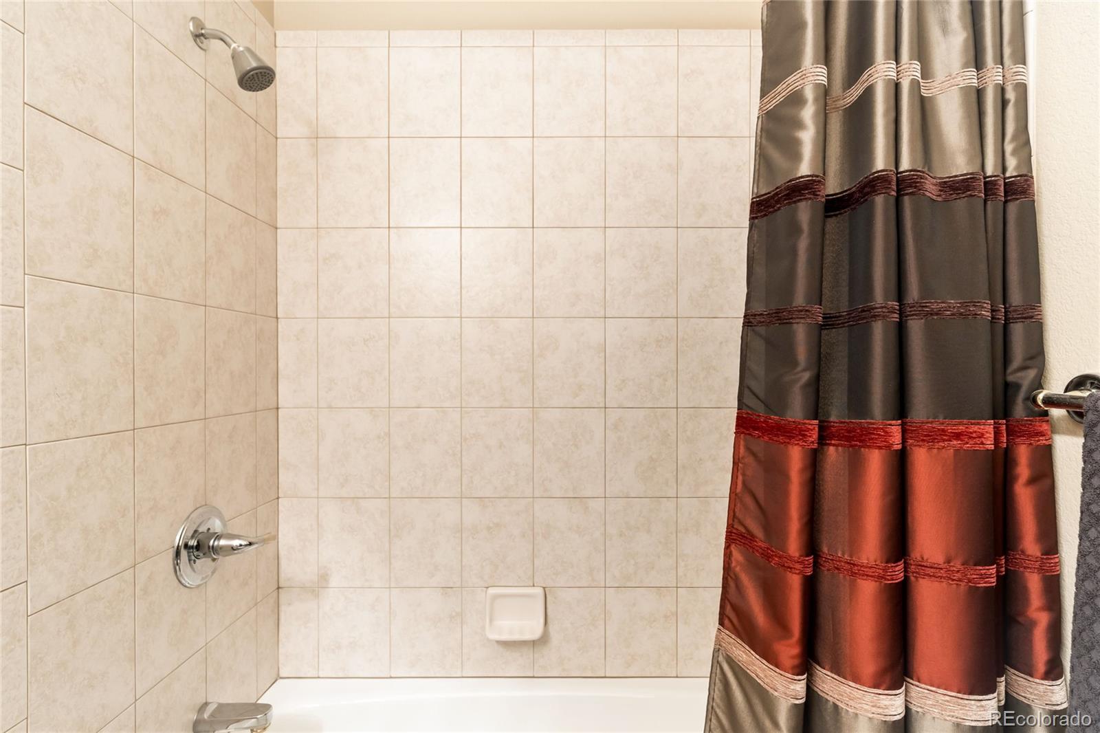 2013 Trail Ridge Drive Severance, CO 80615 - Photo 30 of 49 a bathroom with a shower