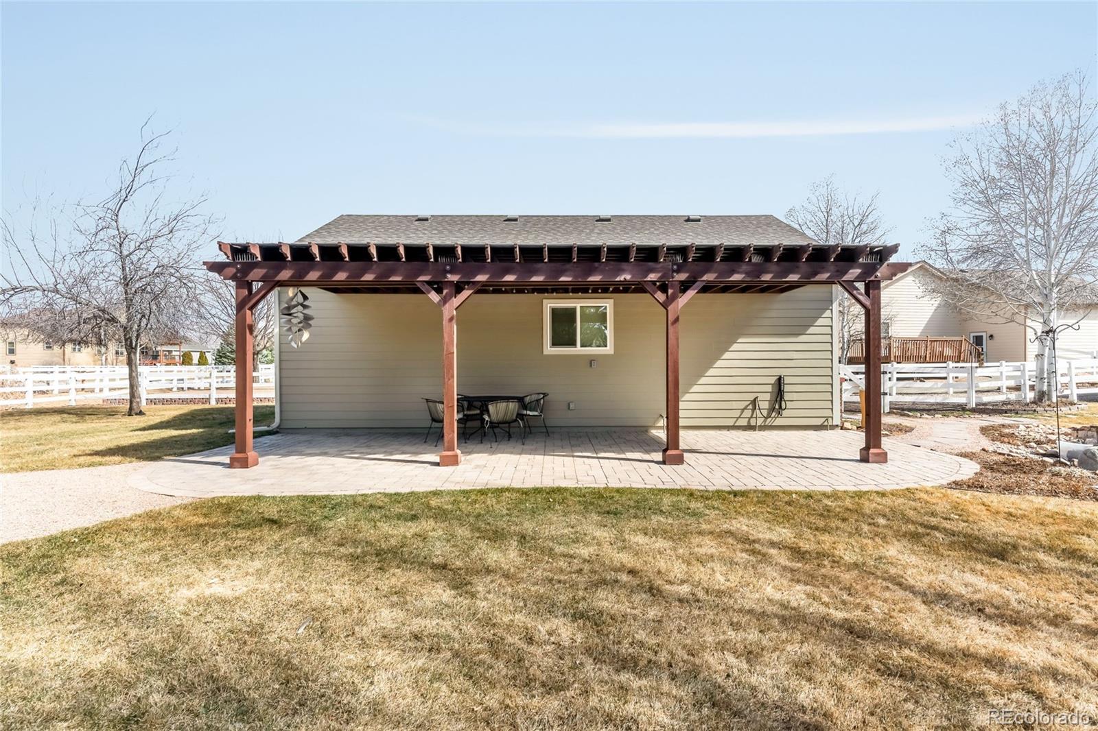 2013 Trail Ridge Drive Severance, CO 80615 - Photo 40 of 49 a view of a house with snow on the wall
