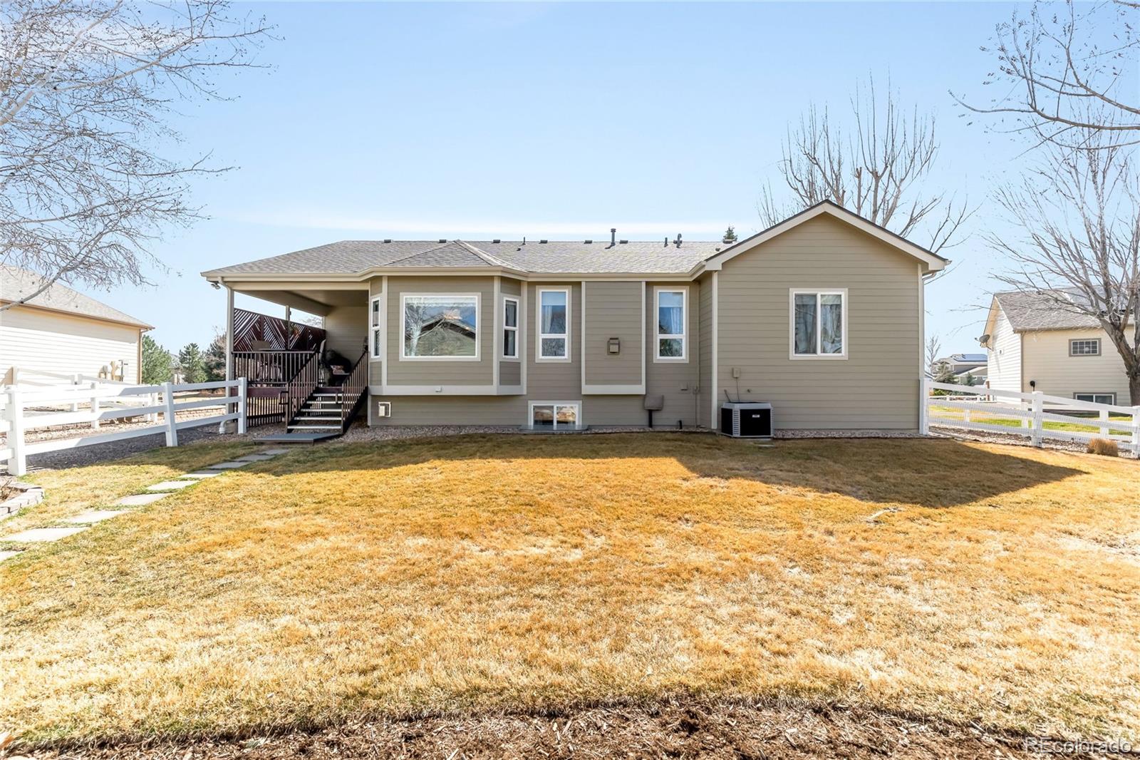 2013 Trail Ridge Drive Severance, CO 80615 - Photo 45 of 49 a front view of a house with a yard