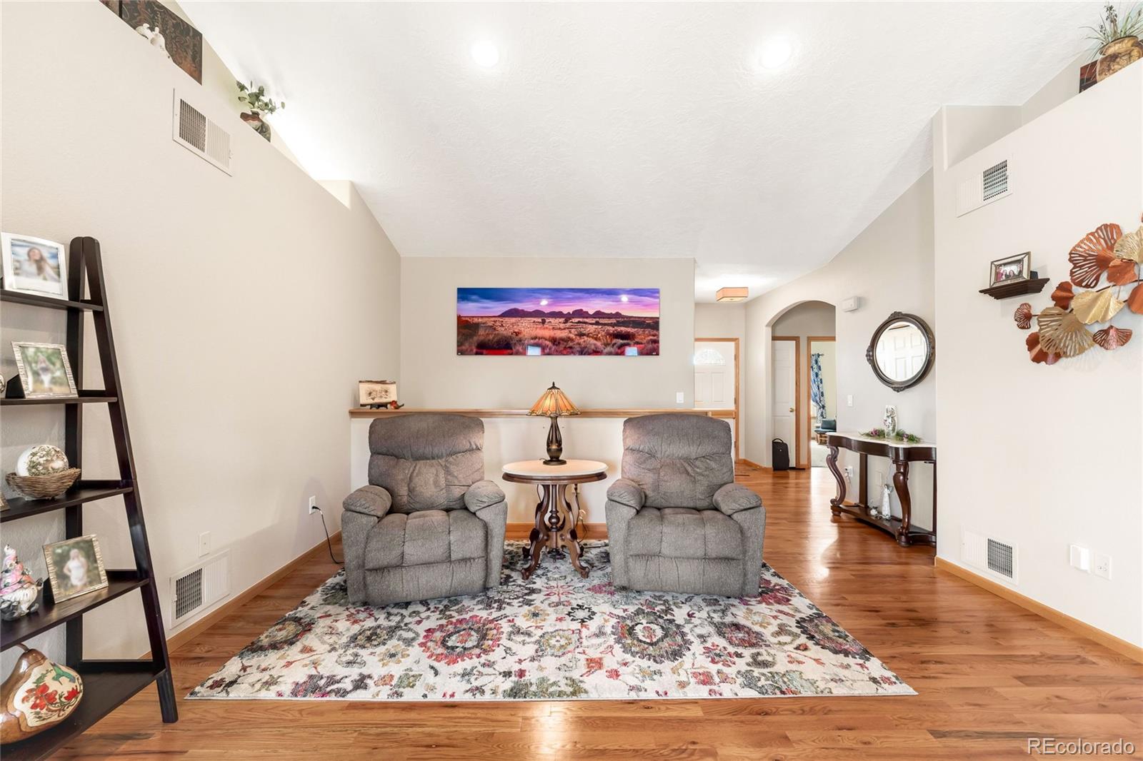 2013 Trail Ridge Drive Severance, CO 80615 - Photo 7 of 49 a living room with furniture and wooden floor