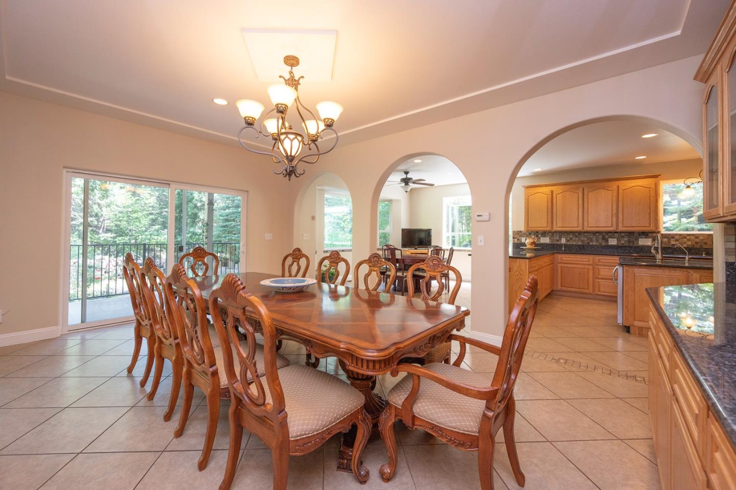 2271 Murphys Drive Arnold, CA 95223 - Photo 22 of 91 a view of a dining room with furniture a chandelier and wooden floor