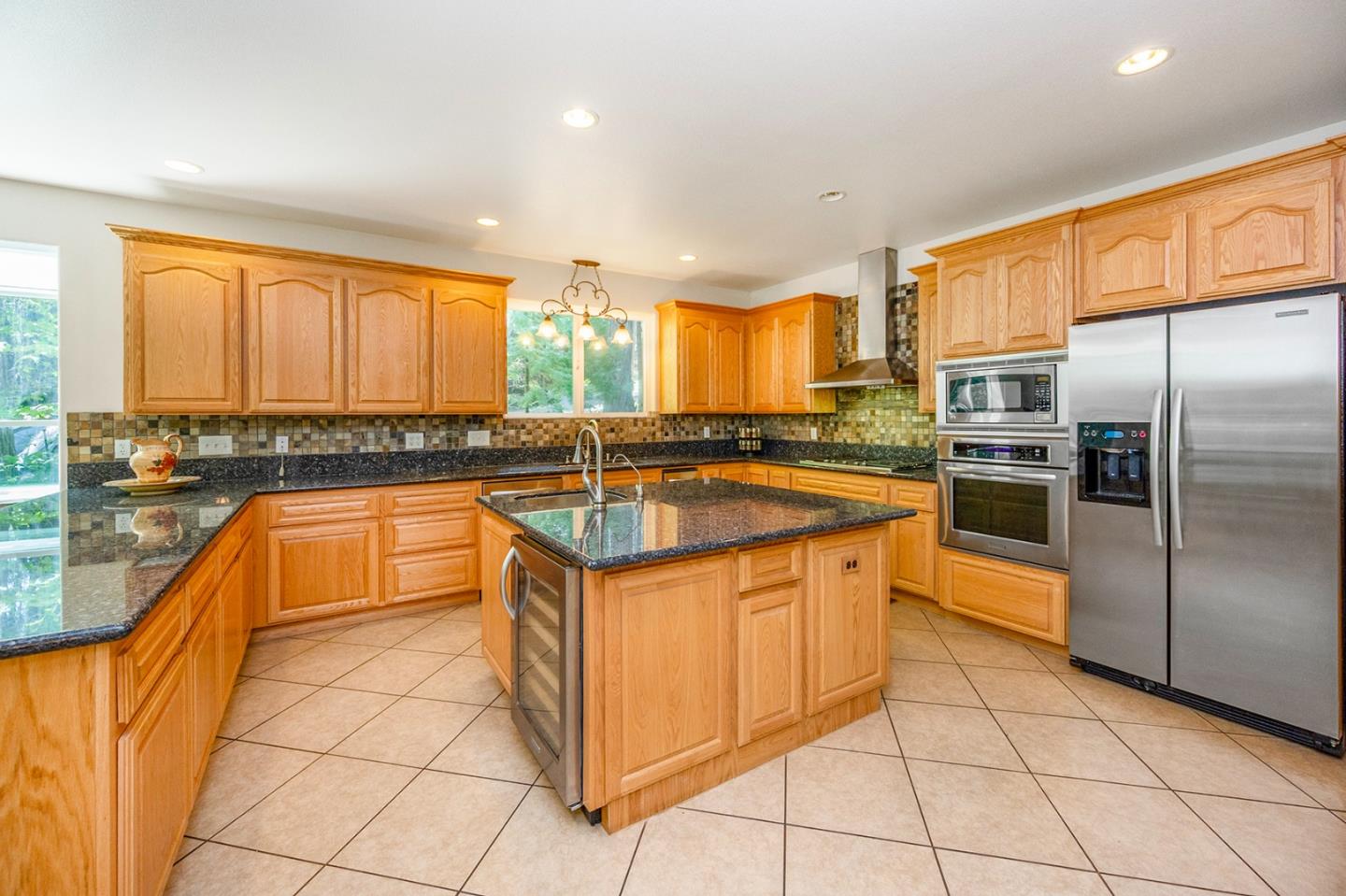 2271 Murphys Drive Arnold, CA 95223 - Photo 25 of 91 a kitchen with stainless steel appliances granite countertop a stove a sink and a refrigerator