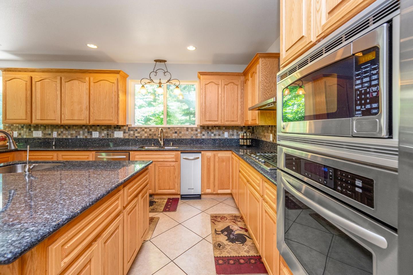 2271 Murphys Drive Arnold, CA 95223 - Photo 26 of 91 a kitchen with stainless steel appliances granite countertop a sink and a counter