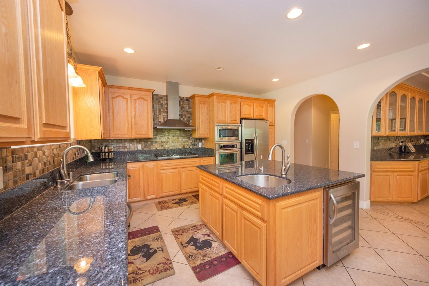 2271 Murphys Drive Arnold, CA 95223 - Photo 28 of 91 a kitchen with stainless steel appliances granite countertop a sink and a refrigerator