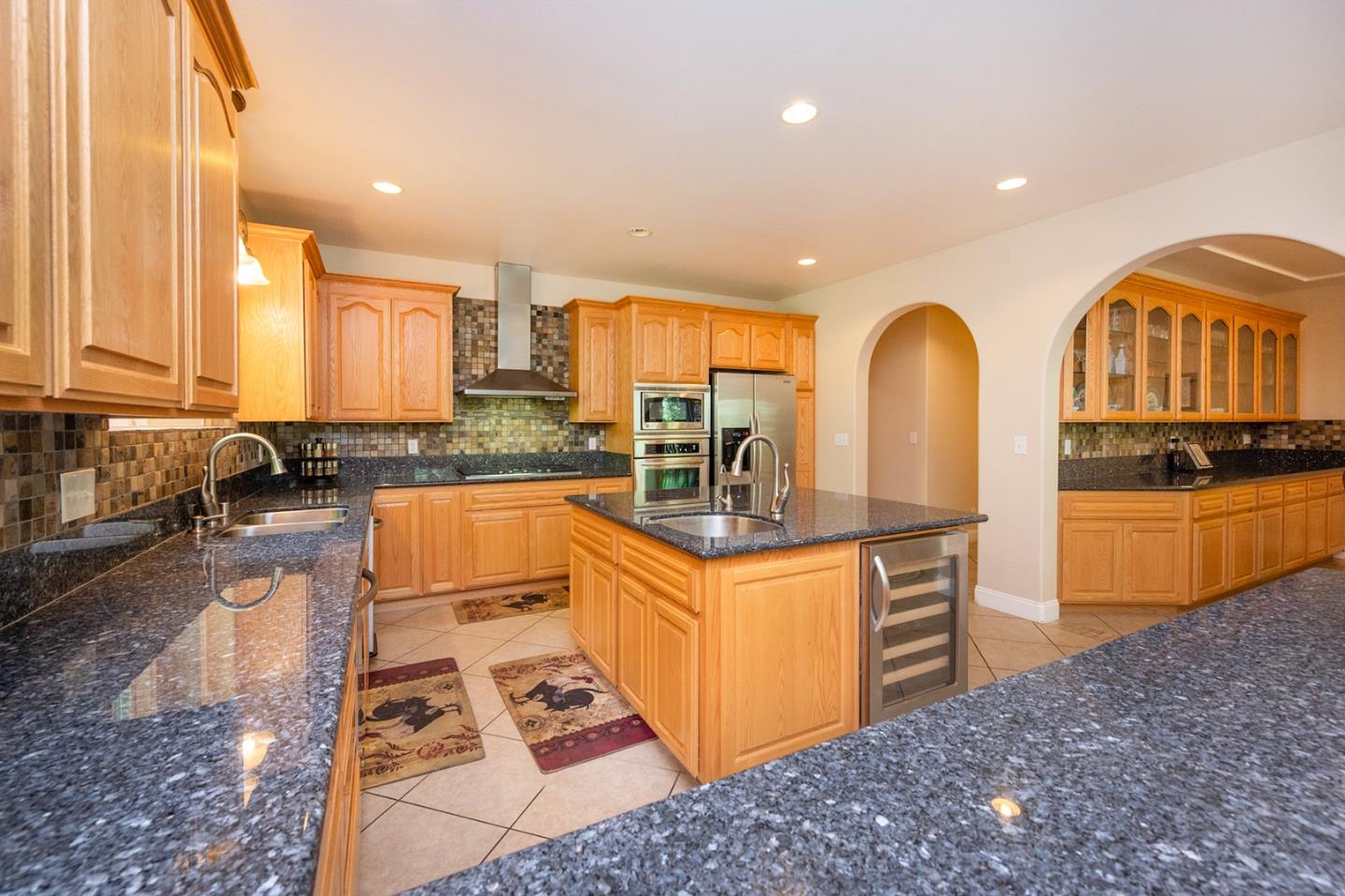 2271 Murphys Drive Arnold, CA 95223 - Photo 30 of 91 a kitchen with stainless steel appliances granite countertop a stove a sink and a refrigerator