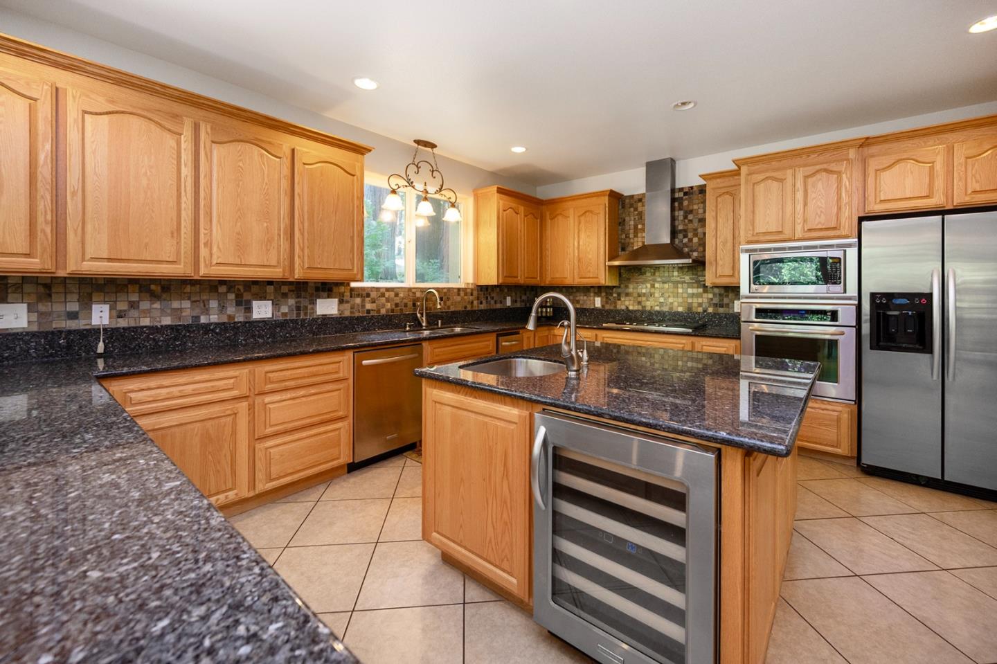 2271 Murphys Drive Arnold, CA 95223 - Photo 33 of 91 a kitchen with stainless steel appliances granite countertop a sink stove and refrigerator