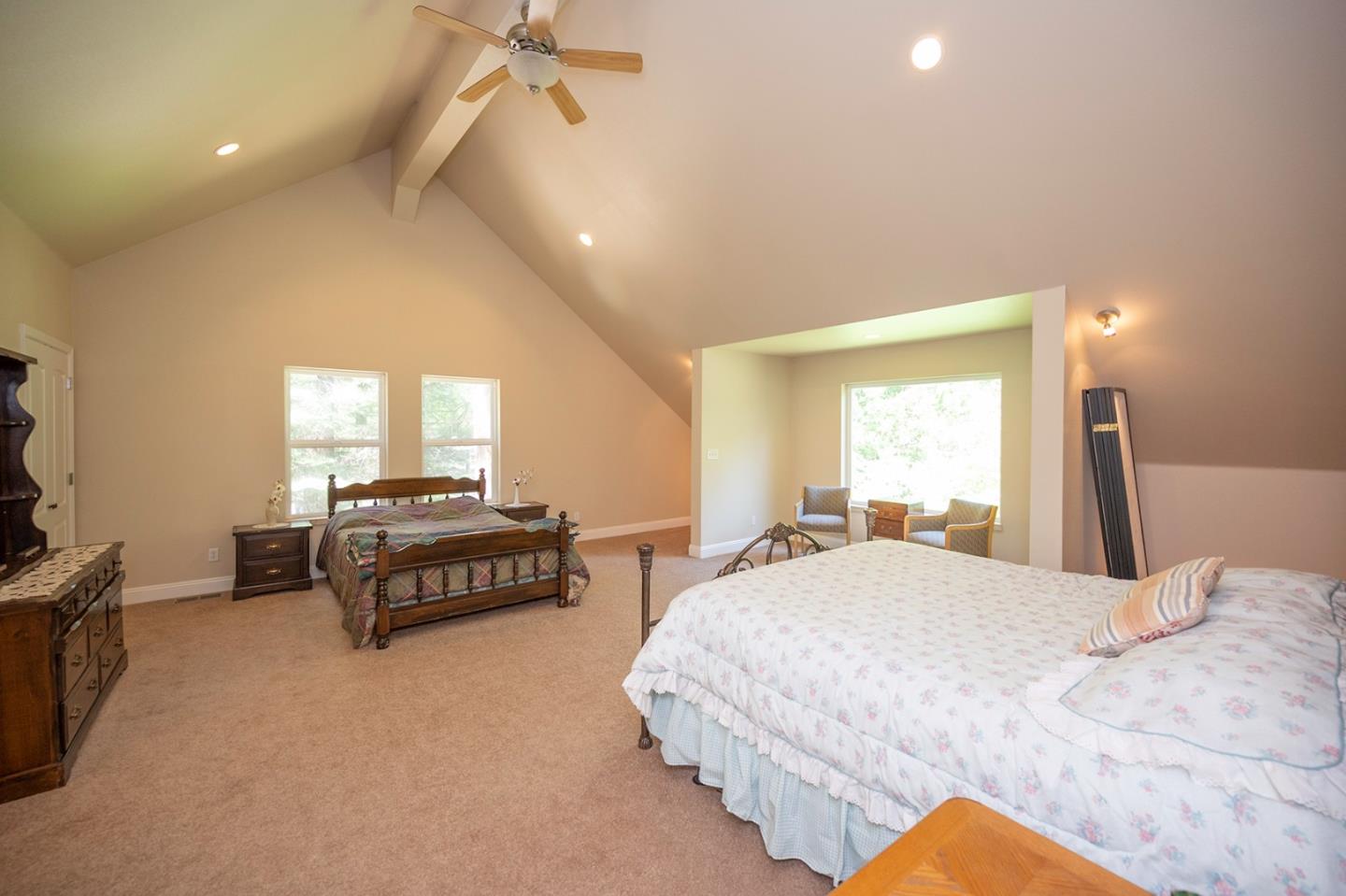 2271 Murphys Drive Arnold, CA 95223 - Photo 67 of 91 a spacious bedroom with a bed and a chandelier