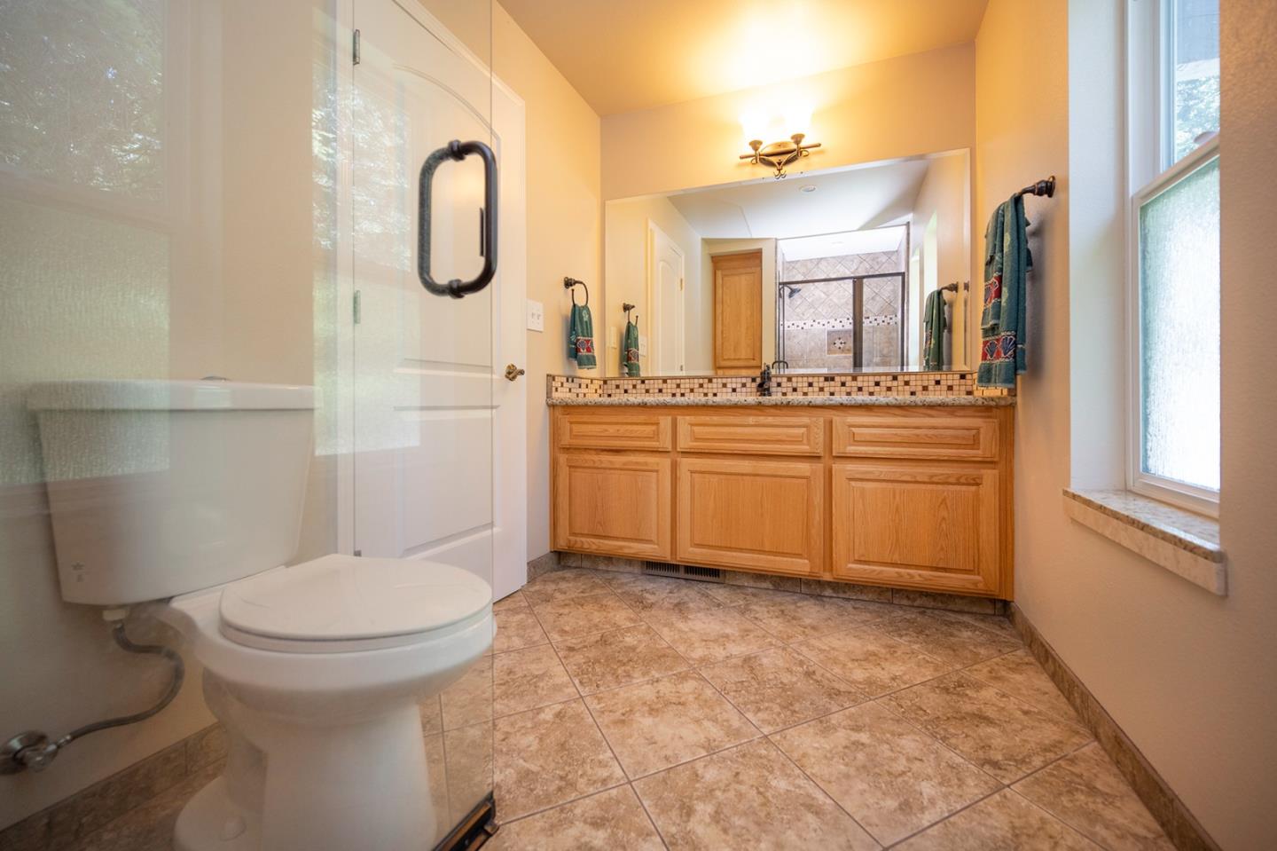 2271 Murphys Drive Arnold, CA 95223 - Photo 74 of 91 a bathroom with a sink a toilet and a mirror