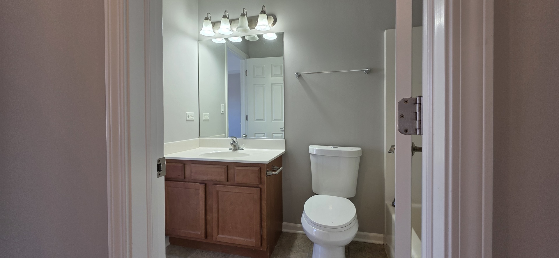 4313 Timber Ridge Court Joliet, IL 60431 - Photo 15 of 24 a bathroom with a toilet sink and mirror