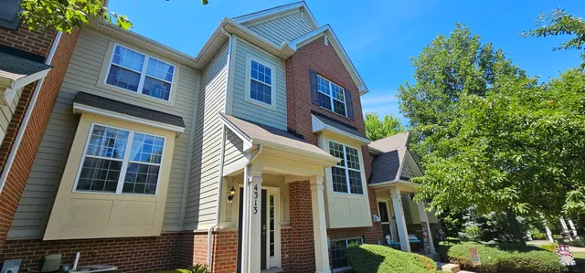 a front view of a multi story residential apartment building