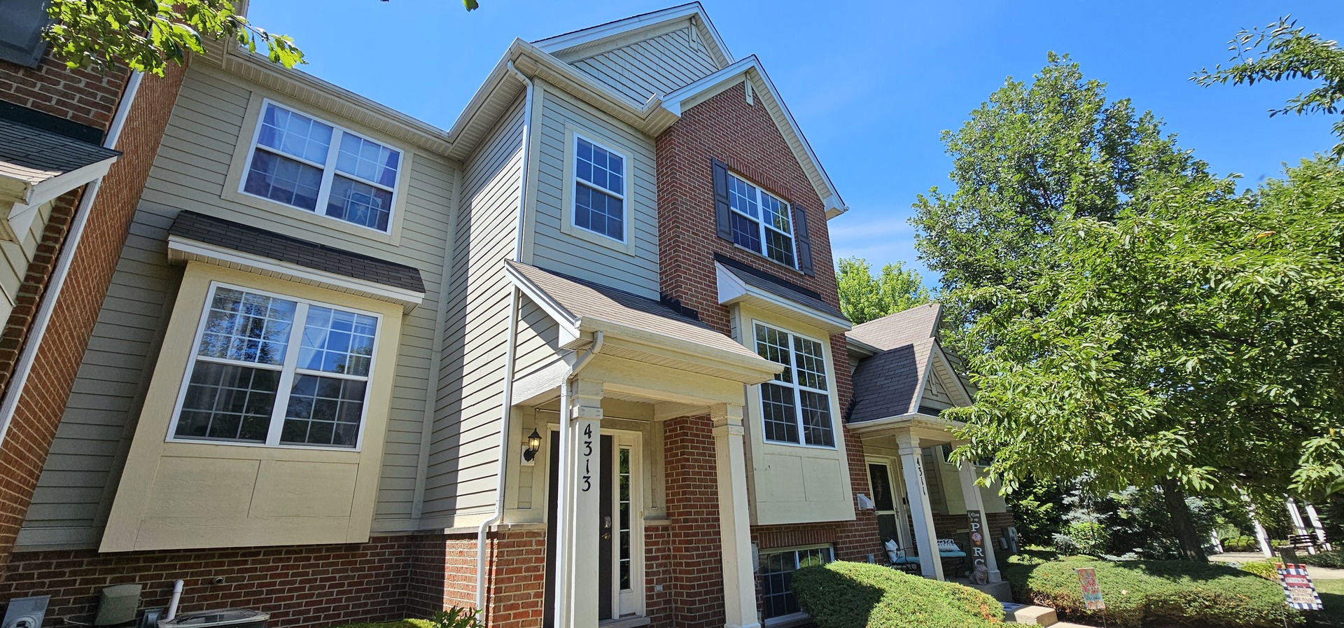 4313 Timber Ridge Court Joliet, IL 60431 - Photo 2 of 24 a front view of a multi story residential apartment building