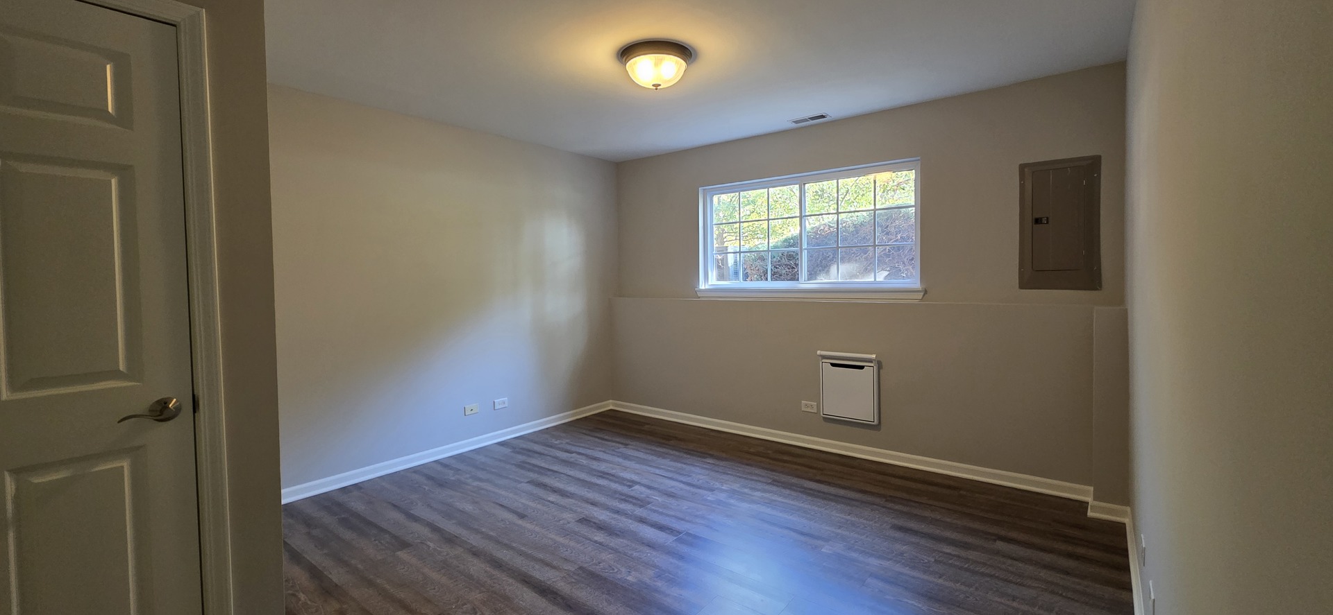 4313 Timber Ridge Court Joliet, IL 60431 - Photo 21 of 24 an empty room with wooden floor and windows