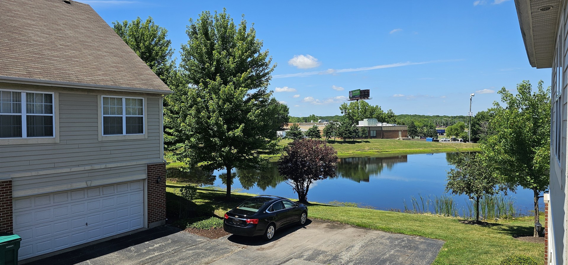 4313 Timber Ridge Court Joliet, IL 60431 - Photo 5 of 24 a view of a house with a yard and a pond
