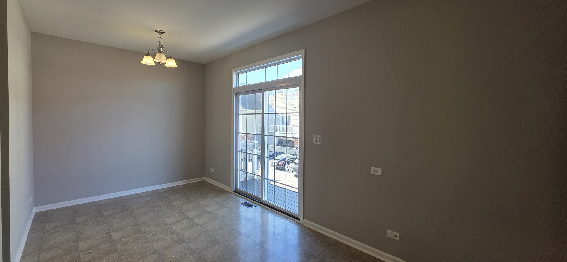 4313 Timber Ridge Court Joliet, IL 60431 - Photo 10 of 24 wooden floor in an empty room with a window