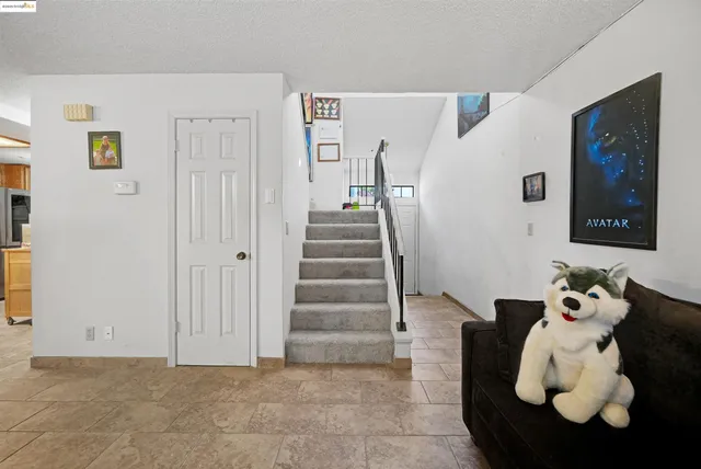 a living room with furniture and a area