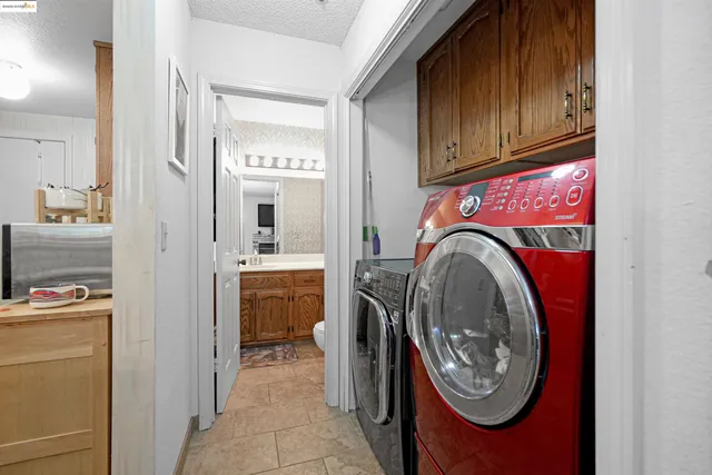 a kitchen with stainless steel appliances a refrigerator stove and microwave