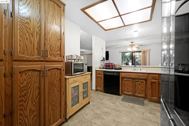 a bathroom with a sink vanity mirror and toilet