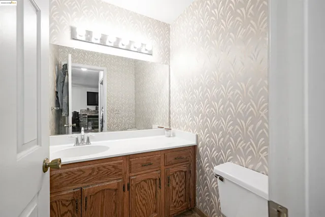 a view of a hallway with paintings on the wall