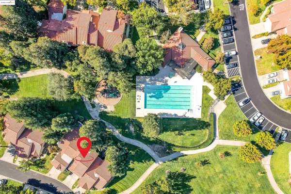 an aerial view of residential houses with outdoor space