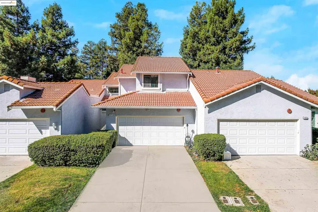 a view of a pathway of a house with wooden walls