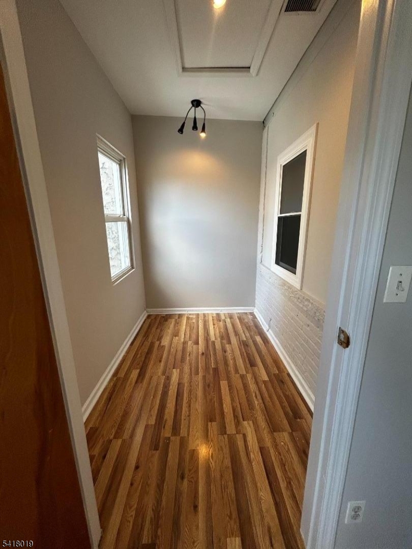 26 Ferry Street Newark, NJ 07105 - Photo 10 of 16 wooden floor in an empty room with a window