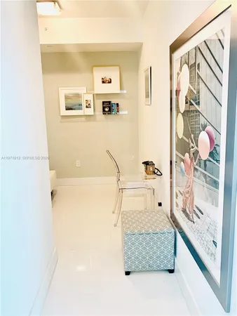 a bathroom with a granite countertop sink a mirror and shower