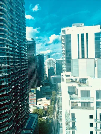 a view of a patio with table and chairs and potted plants