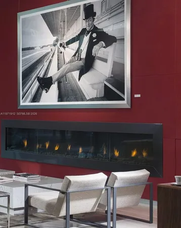 a living room with furniture and floor to ceiling window