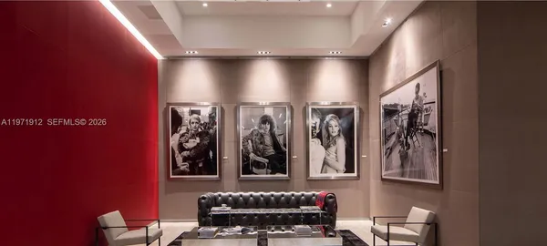 a bathroom with a large mirror and vanity