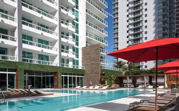 a view of pool with outdoor seating