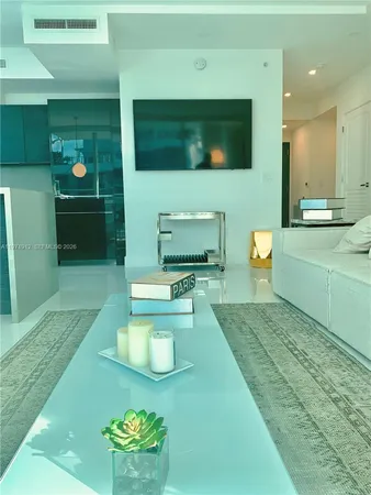 a living room with a couch and a flat screen tv