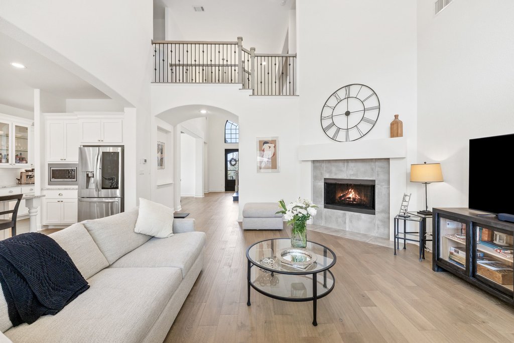 5812 Davenport Divide Road Austin, TX 78738 - Photo 6 of 40 An open, airy living space where the fireplace flickers in the background and conversations carry easily from one room to the next.