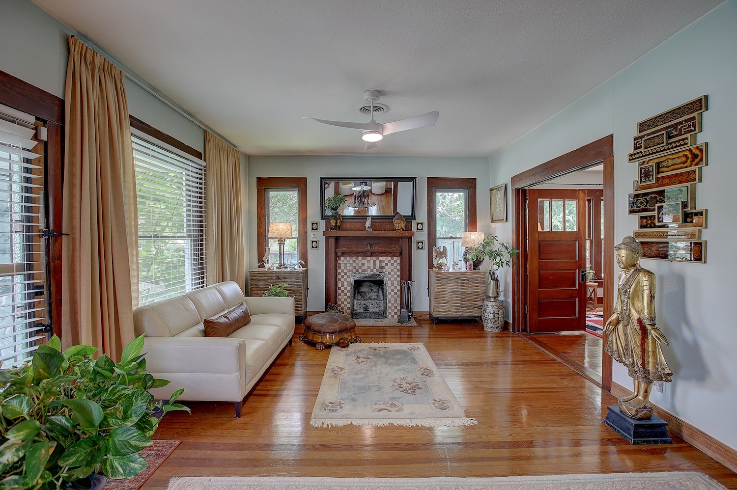 1903 South Austin Avenue Georgetown, TX 78626 - Photo 5 of 40 Welcome to the living room. Buttery soft Long Leaf pine flooring is buffed and polished but tells a 100+ year old story. Notice the woodwork has not been painted to honor the craftsmen who used premium wood and built with pride.