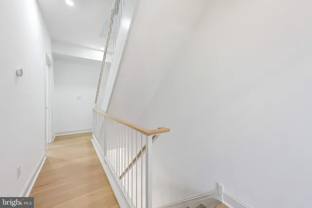 a view of a hallway with staircase