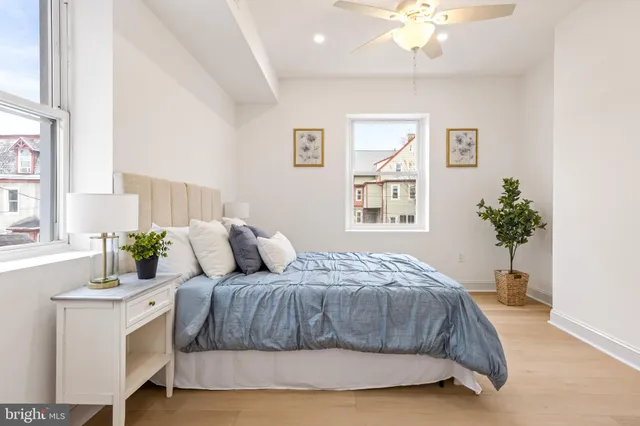 a bedroom with a bed and a table