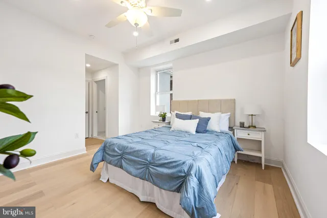 a bathroom with a double vanity sink a toilet and a mirror