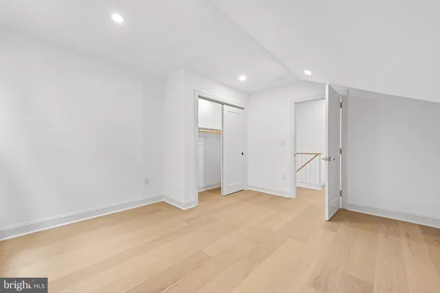 a bathroom with a granite countertop sink a toilet and bathtub