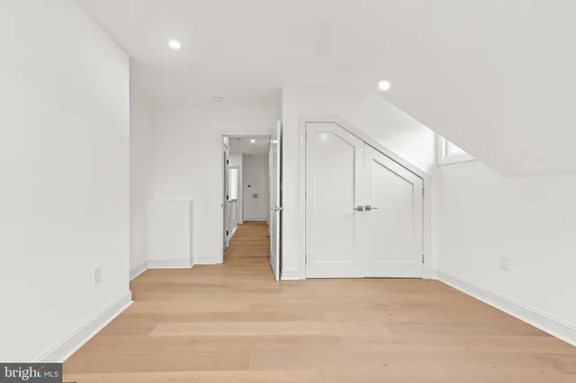 a view of a hallway with a white door