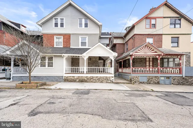 front view of a house with a street