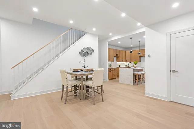 a dining room with furniture and entryway