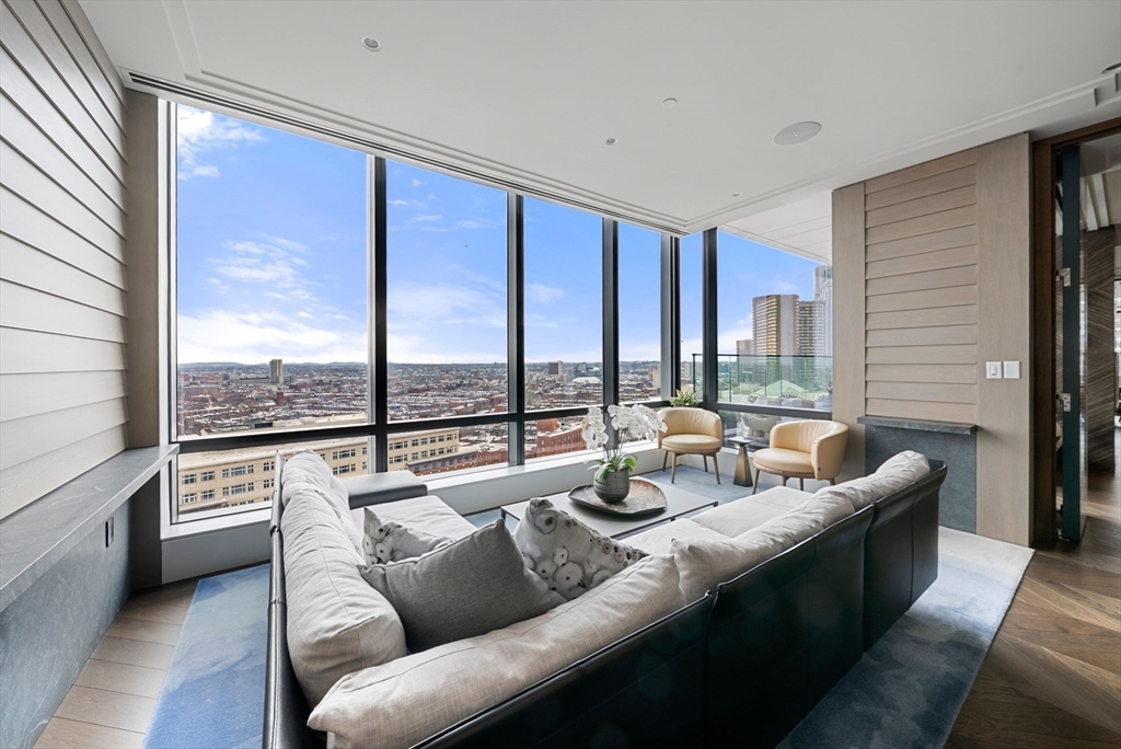 40 Trinity Place, Unit 1518 Boston, MA 02116 - Photo 13 of 25 a living room with furniture and a large window