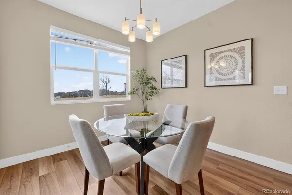 a view of a dining room with furniture window and outside view