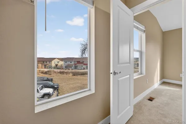 a view of a glass door with a balcony