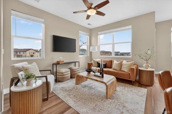 a living room with furniture and a flat screen tv