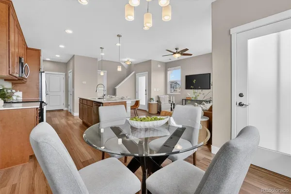 a view of a dining room with furniture and a chandelier