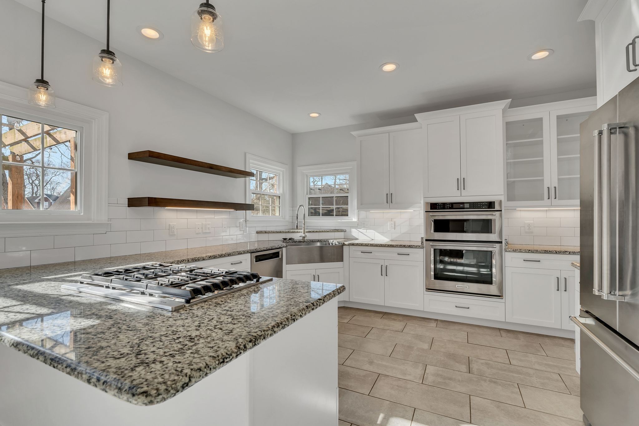 3033 Tybee Trail Murfreesboro, TN 37127 - Photo 14 of 41 a kitchen with a stove a microwave and a refrigerator
