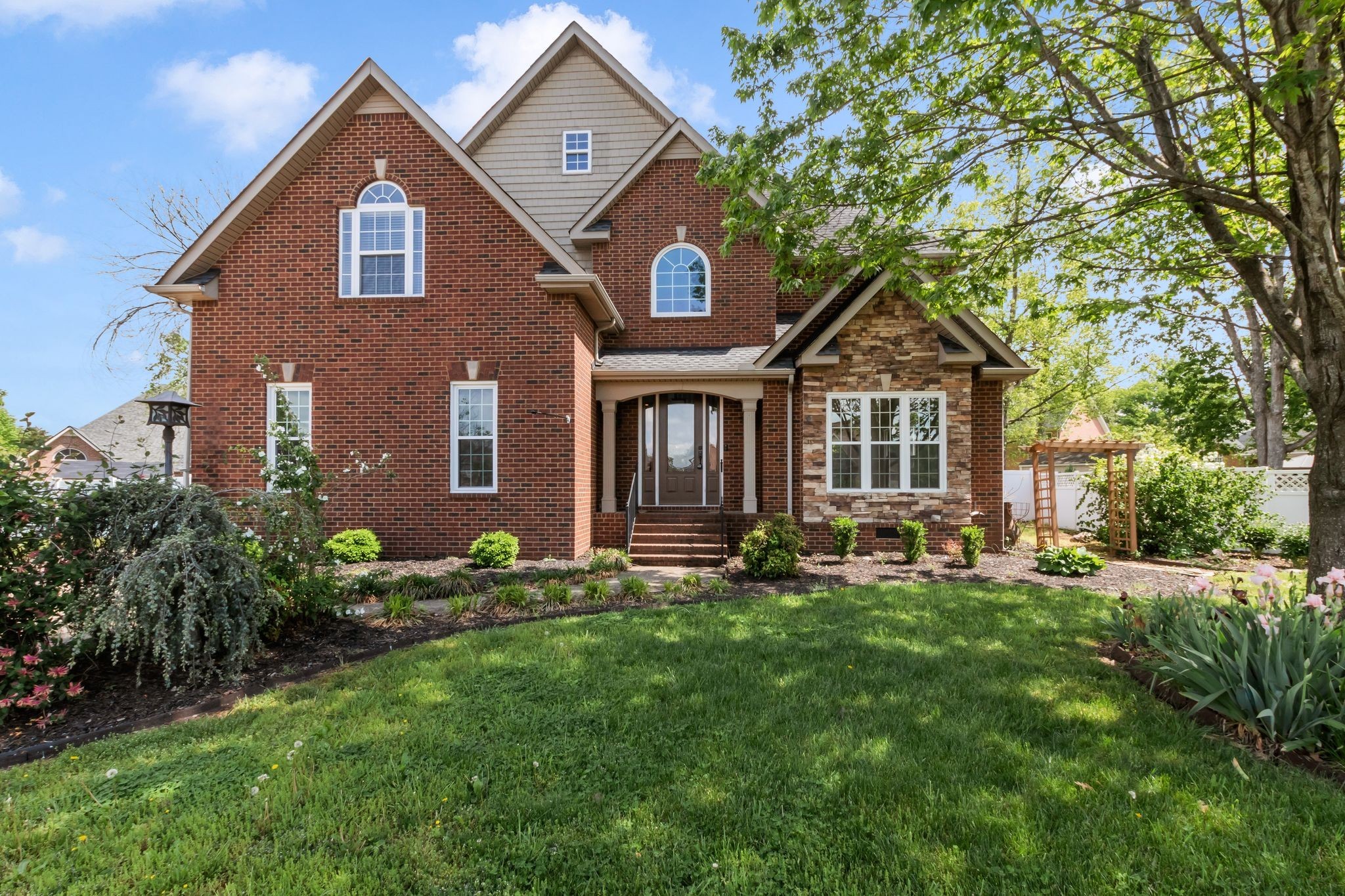 3033 Tybee Trail Murfreesboro, TN 37127 - Photo 3 of 41 a front view of a house with a yard