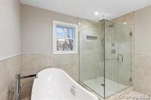 a bathroom with a shower and toilet