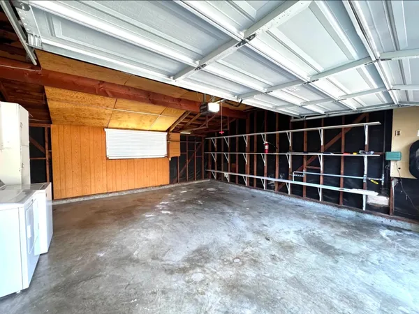 a view of empty room with windows