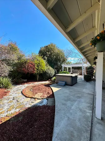 a view of a backyard of the house